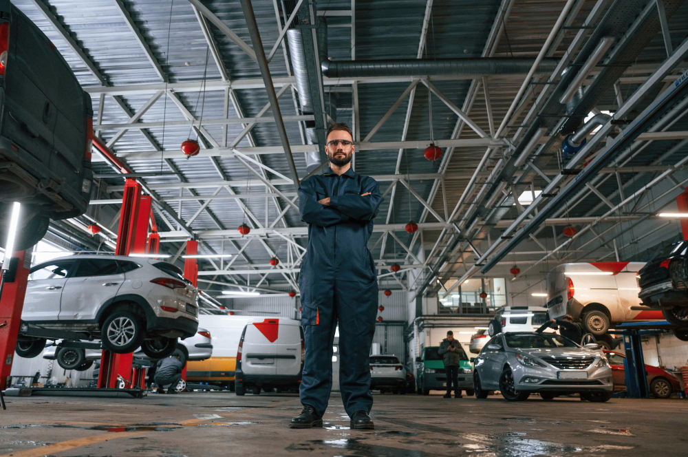 Certified mechanic performing auto car maintenance at Car Workshop Abu Dhabi branch